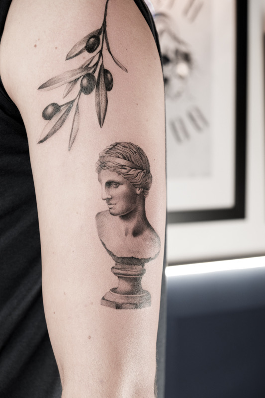 Greek Bust with Pink Cherry Blossom | Tattoo Ideas For Men & Women in 2024