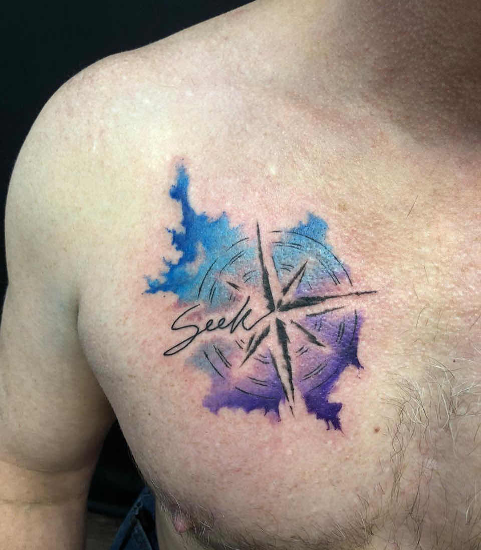 Watercolor style moon star and wave tattoo on the